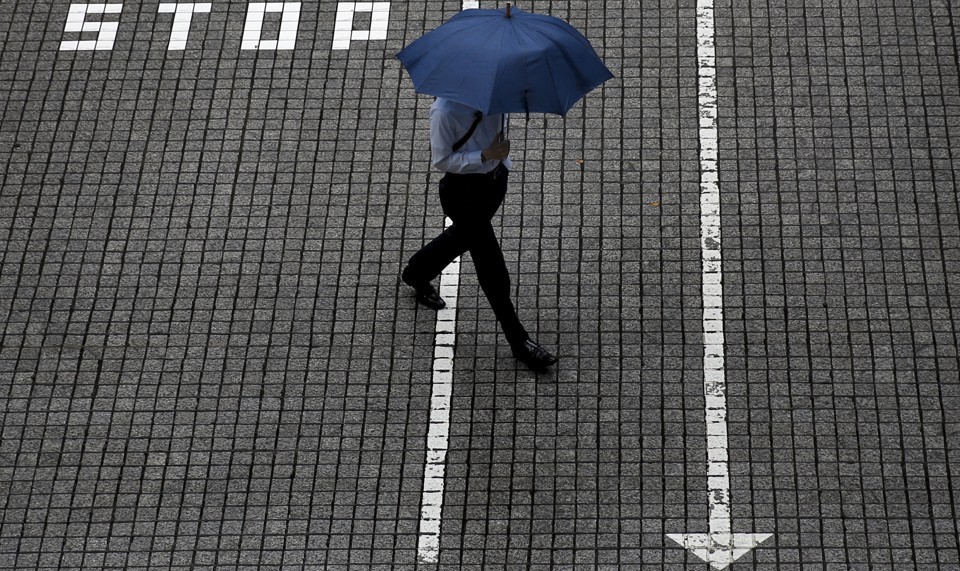 Man Crossing Street With Umbrella